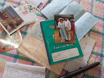 A pile of international mail and postcards.